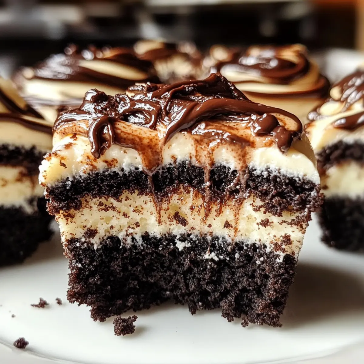 Fudge Swirled Oreo Bottom Cheesecake Cupcakes